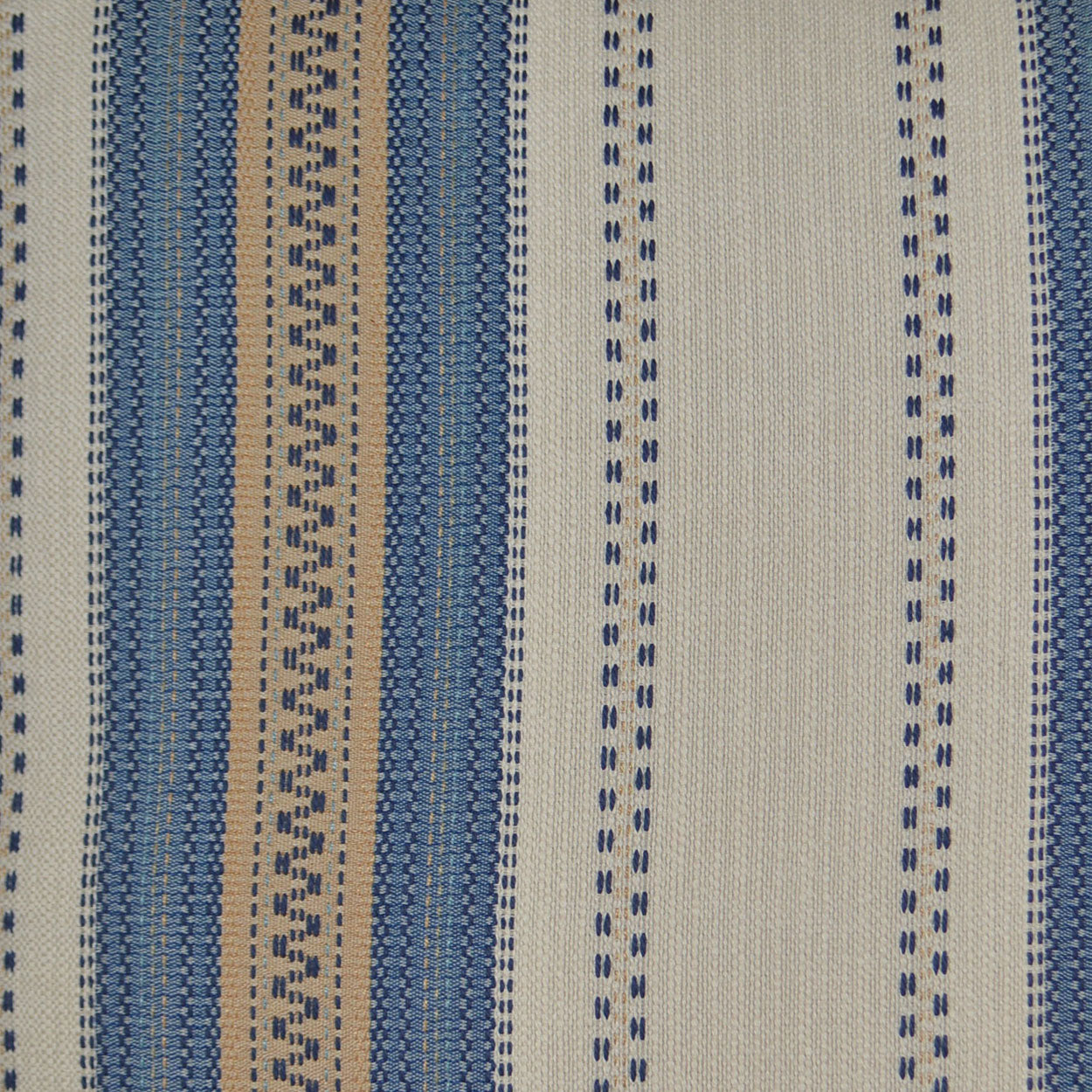 Vertical striped woven fabric in blue and beige tones with dotted navy accents and textured weave.