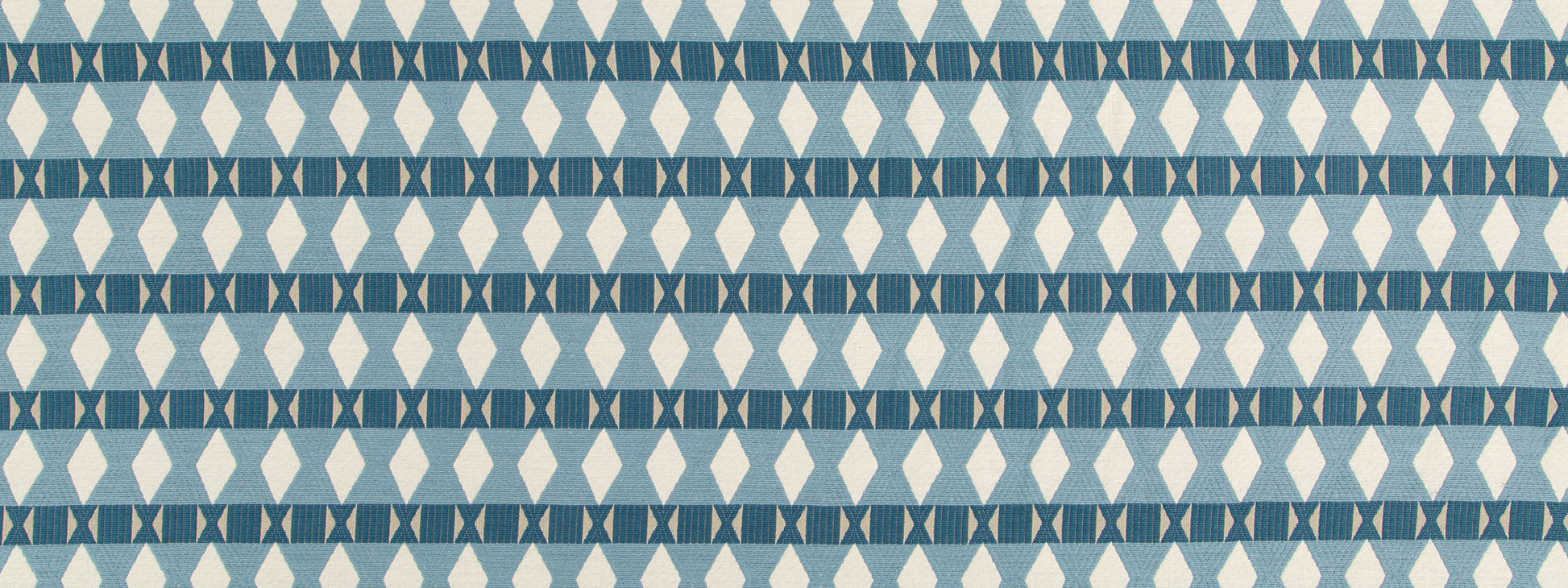 Blue geometric upholstery fabric with repeating diamond and triangle motifs in light and dark blues.