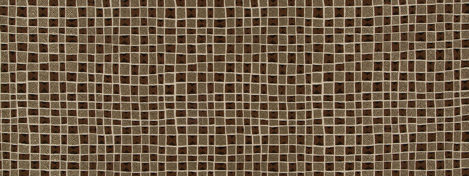 Brown upholstery fabric in carob color.
