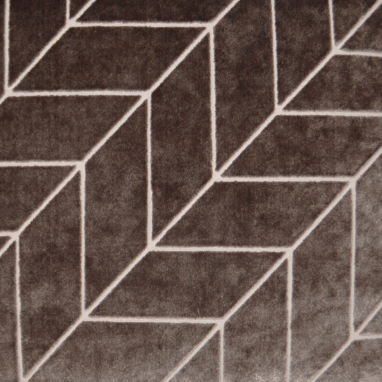 Brown fabric pillow with white geometric cube pattern; 24" x 24