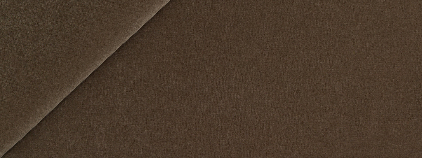 Close-up of Teak-colored material with a diagonal seam and smooth texture.