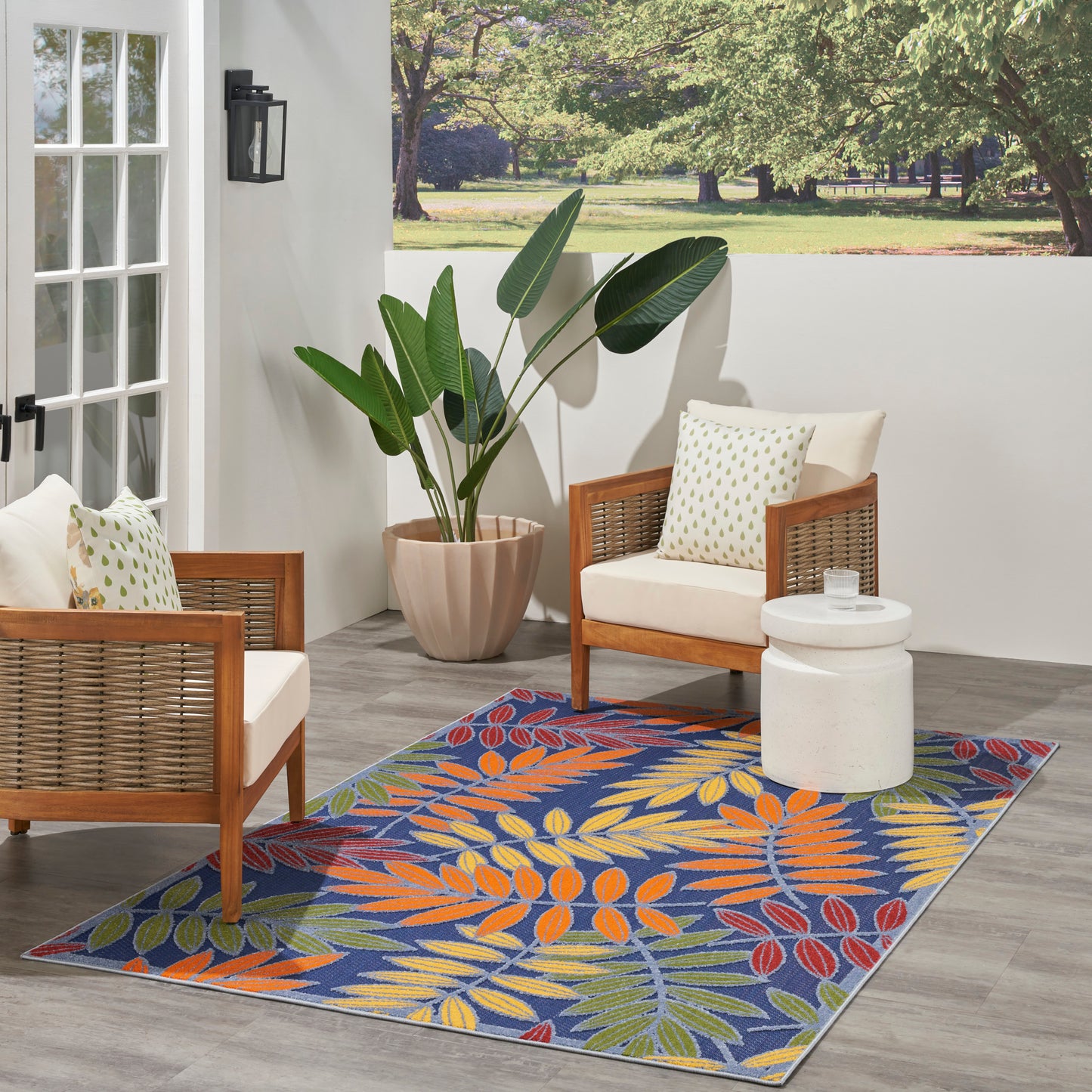 Outdoor 5' x 8' rug with a colorful tropical leaf pattern.