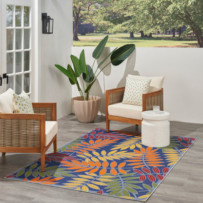Outdoor 5' x 8' rug with a colorful tropical leaf pattern.