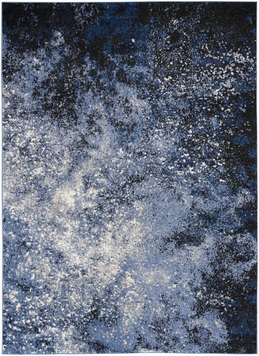 Rectangular blue abstract rug with white and light-blue speckles, galaxy-inspired modern pattern.
