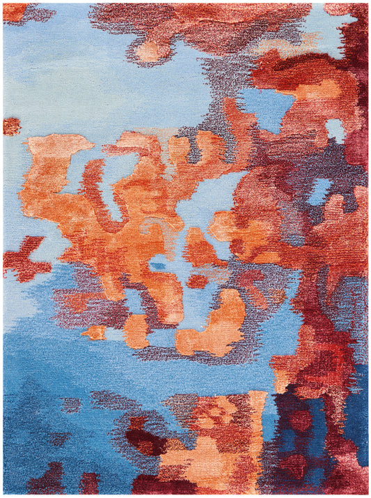 Abstract area rug: blue gradient with orange-red shapes; soft plush pile, modern contemporary floor decor.