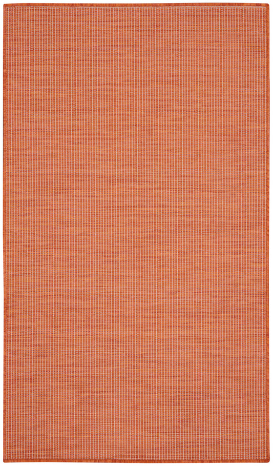 Orange rectangular rug with fine light vertical grid pattern and stitched border.