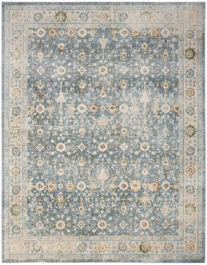 Blue distressed oriental rug with ivory border, cream floral motifs and faded vintage medallion patterns.