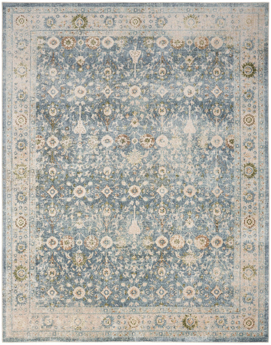 Blue distressed oriental rug with ivory border, cream floral motifs and faded vintage medallion patterns.