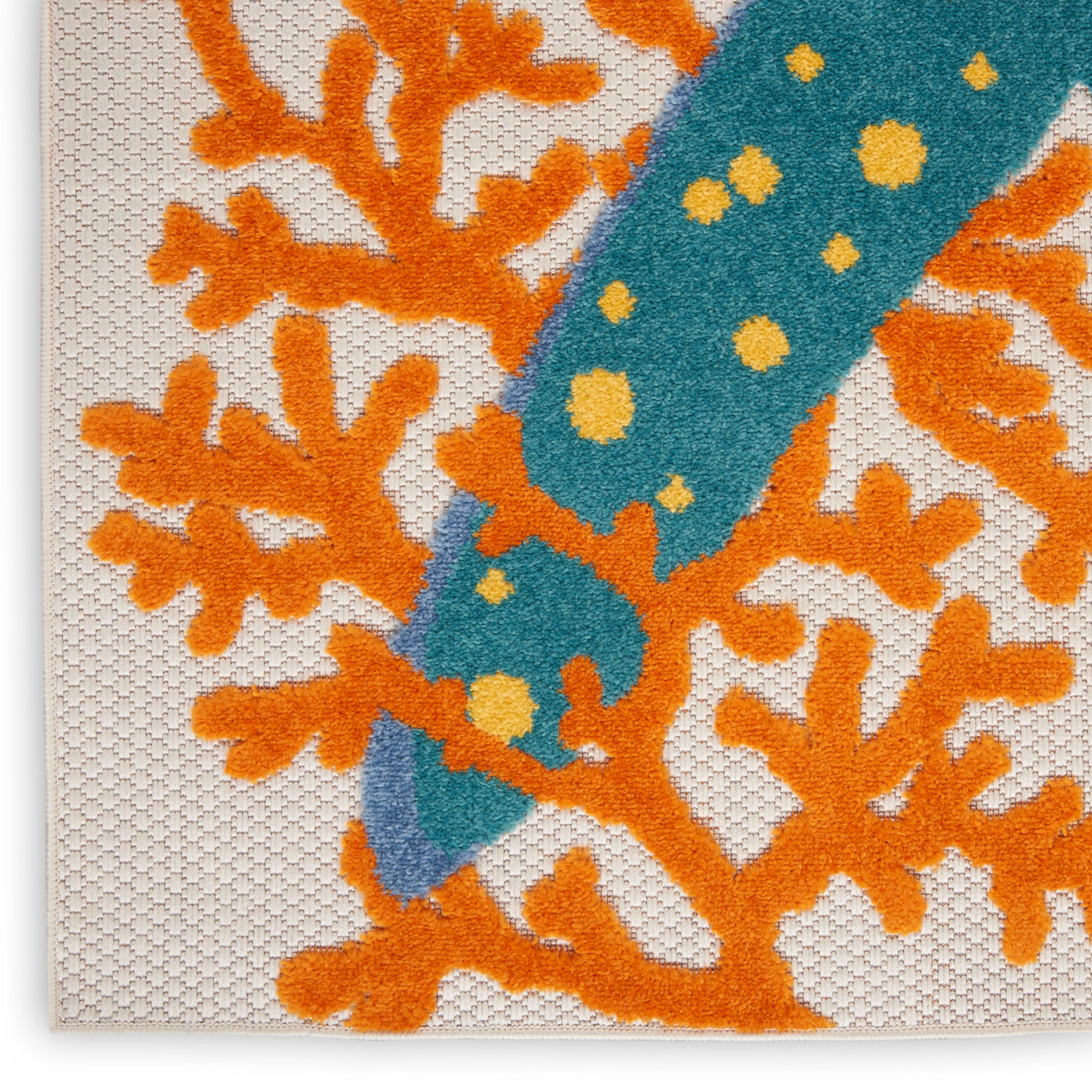 Beige textured canvas fabric with vivid orange coral motif and teal dotted stripe.