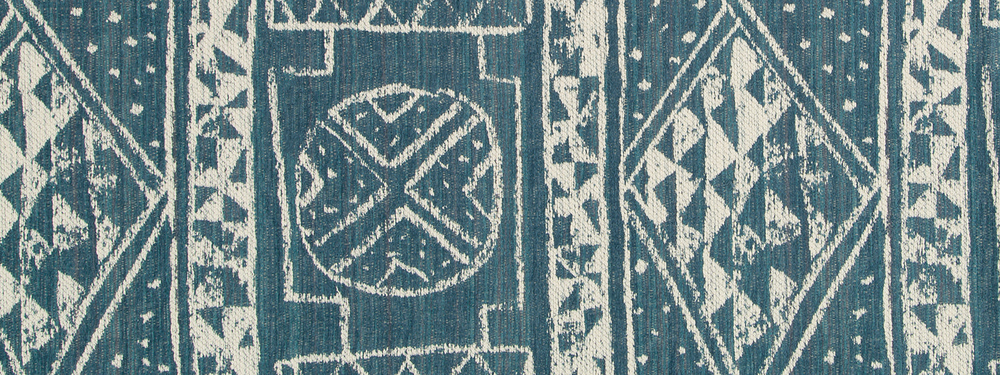 Turquoise woven fabric with white tribal diamond patterns; upholstery fabric.