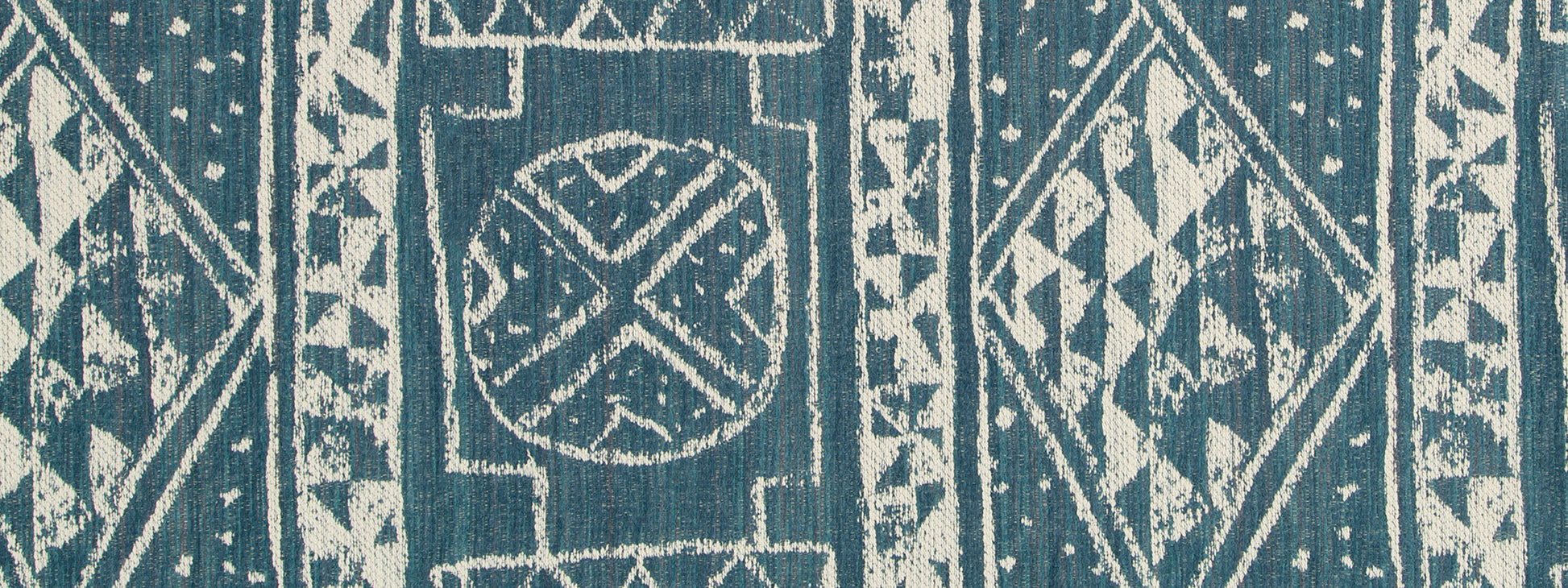 Turquoise woven fabric with white tribal diamond patterns; upholstery fabric.