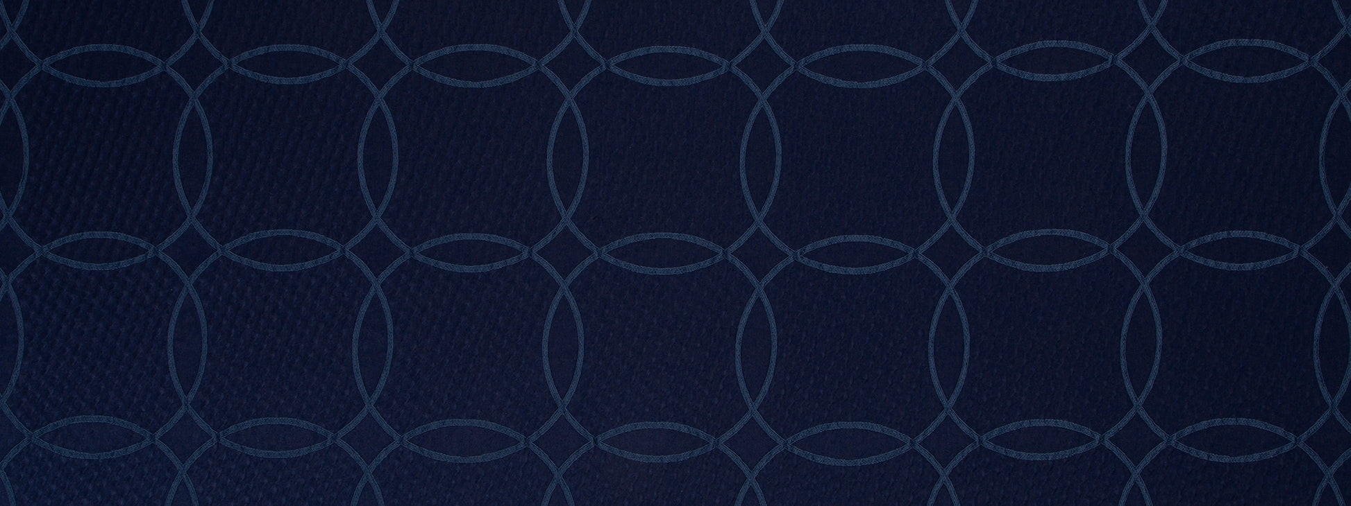 Dark navy background with a repeating light blue interlocking circle chain pattern.