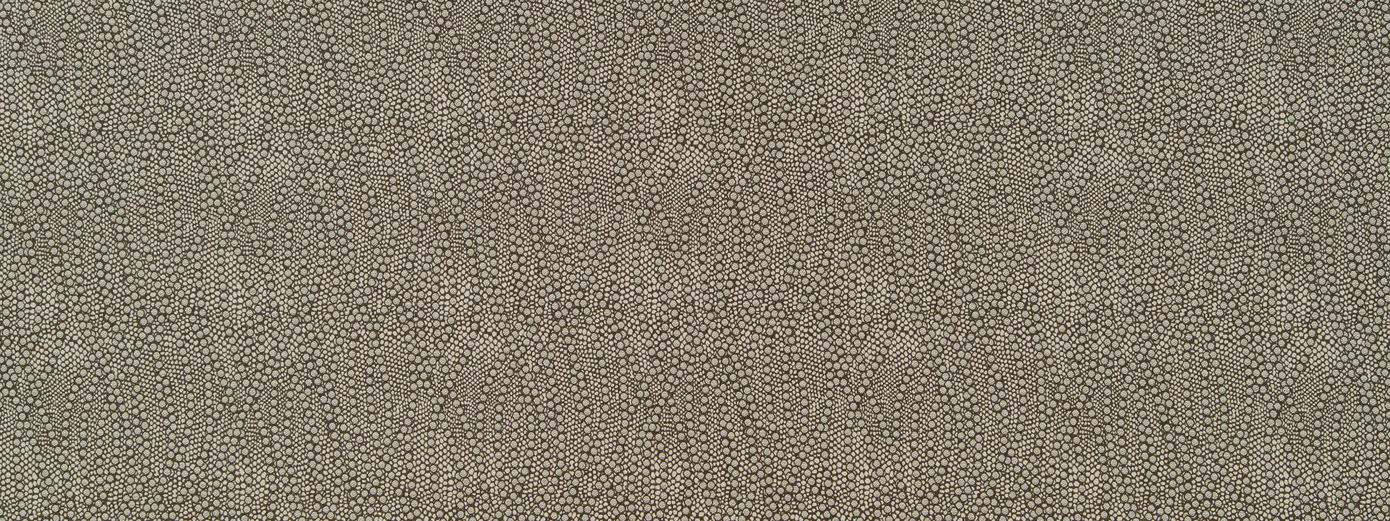 Beige woven fabric with subtle ripple texture and repeating teardrop motif, suitable for upholstery.