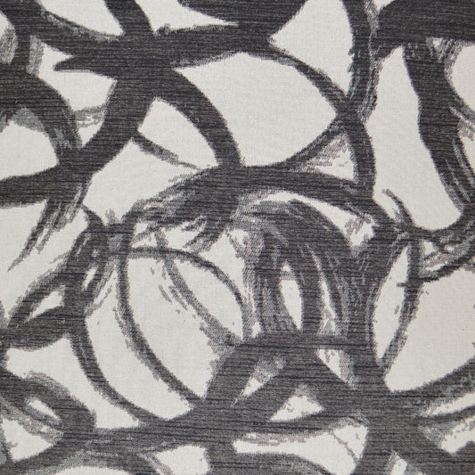 Interlocking circular charcoal loops on pale gray woven fabric, abstract pattern.