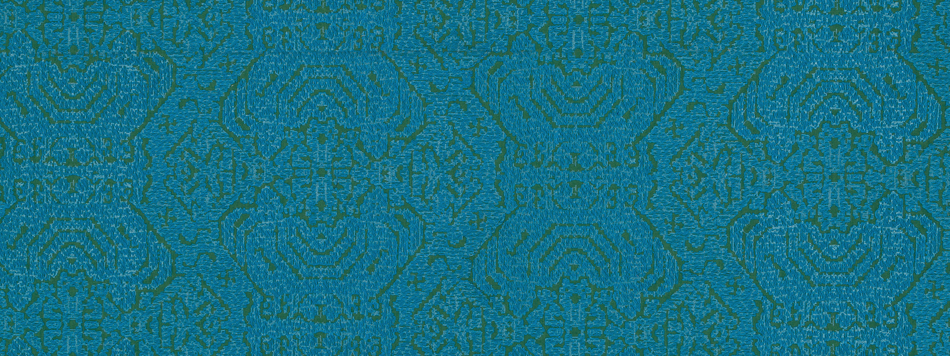 Teal-blue patterned textile with ornate repeating geometric damask motif.