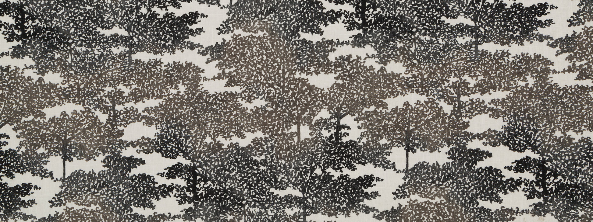 Beige fabric with a graphite-style forest tree silhouette pattern; woodland print suitable for upholstery or wallpaper.