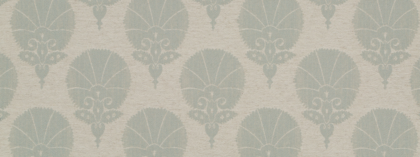 Muted teal damask pattern on warm beige upholstery fabric with shell-like motifs; vintage-inspired.
