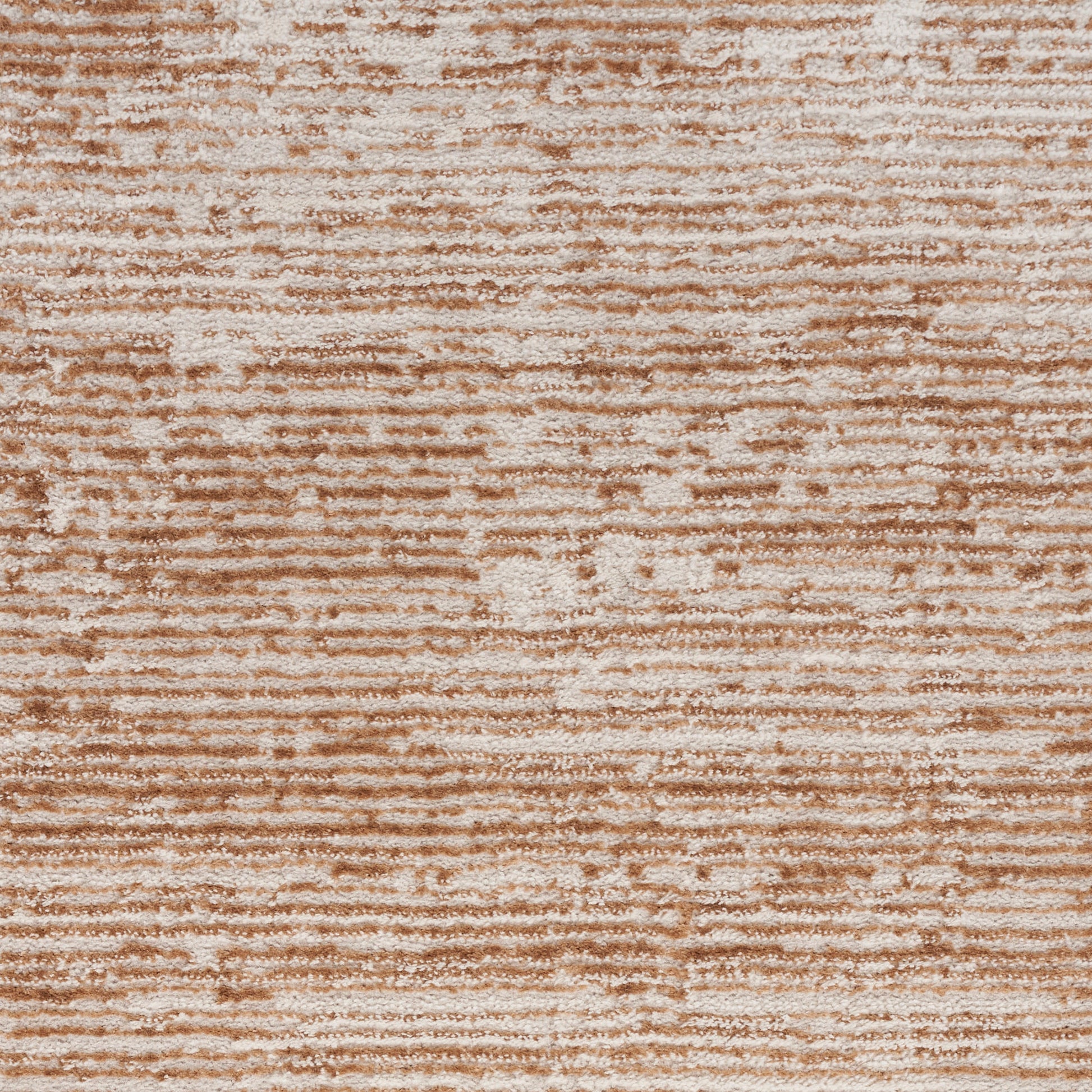 Warm beige-brown crushed-velvet fabric with horizontal striped texture; plush upholstery or rug accent.