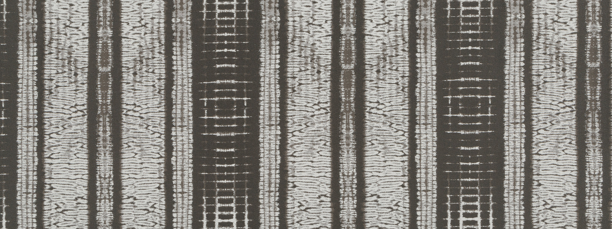 Woven striped runner in brown and beige tones with a textured vertical pattern.