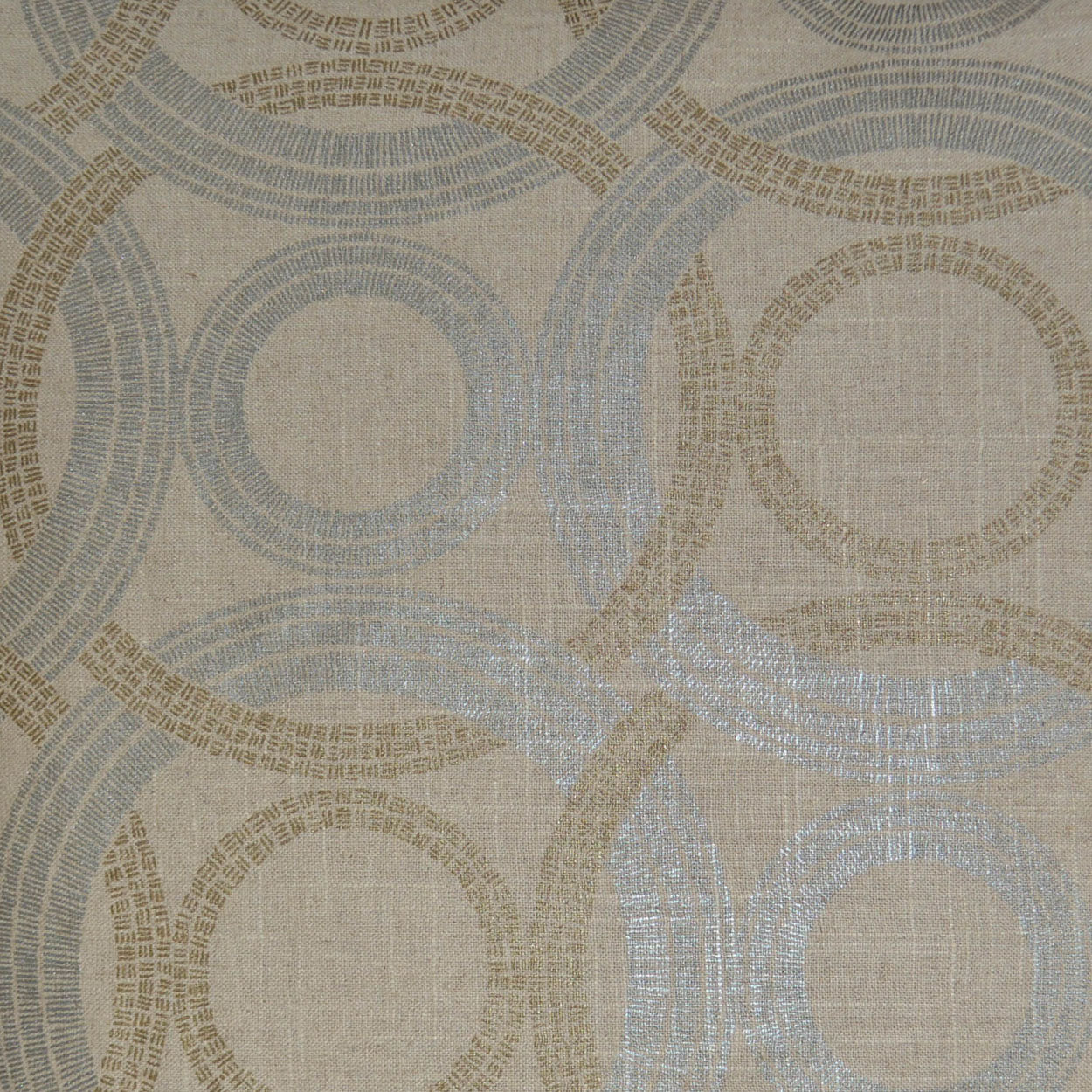 Beige fabric with overlapping circular ring motifs in pale blue & taupe, woven linen texture.