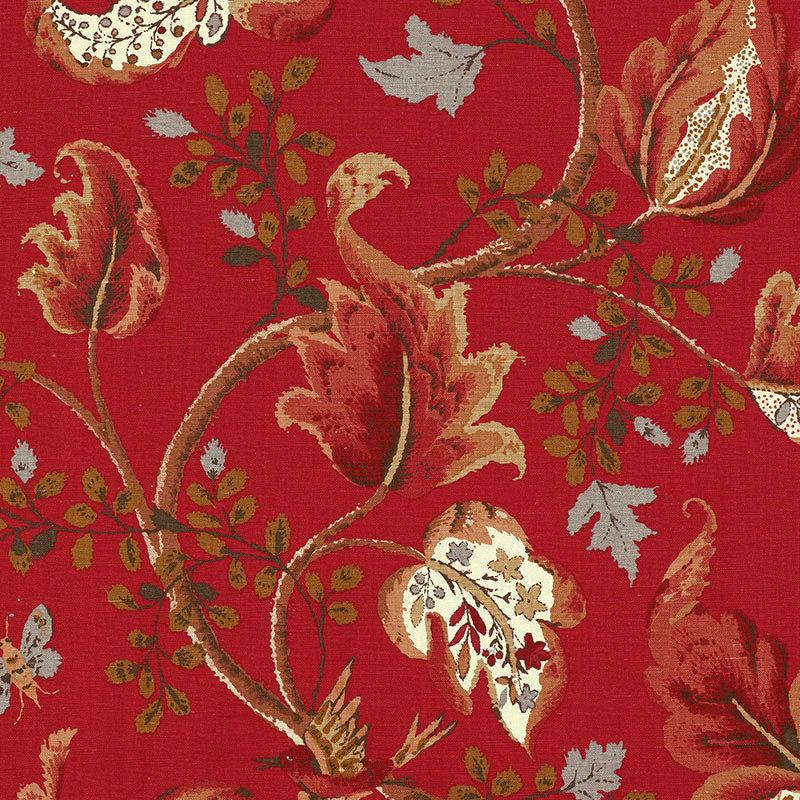 Red damask-style upholstery fabric with gold vines, brown florals and pale blue-gray leaves.