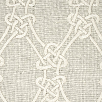 Cream rope knot pattern on beige linen fabric; decorative geometric chain design.