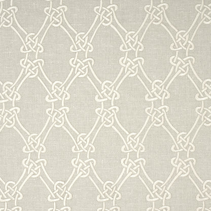 Beige fabric with cream interlocking knot motif forming a repeating lattice pattern.