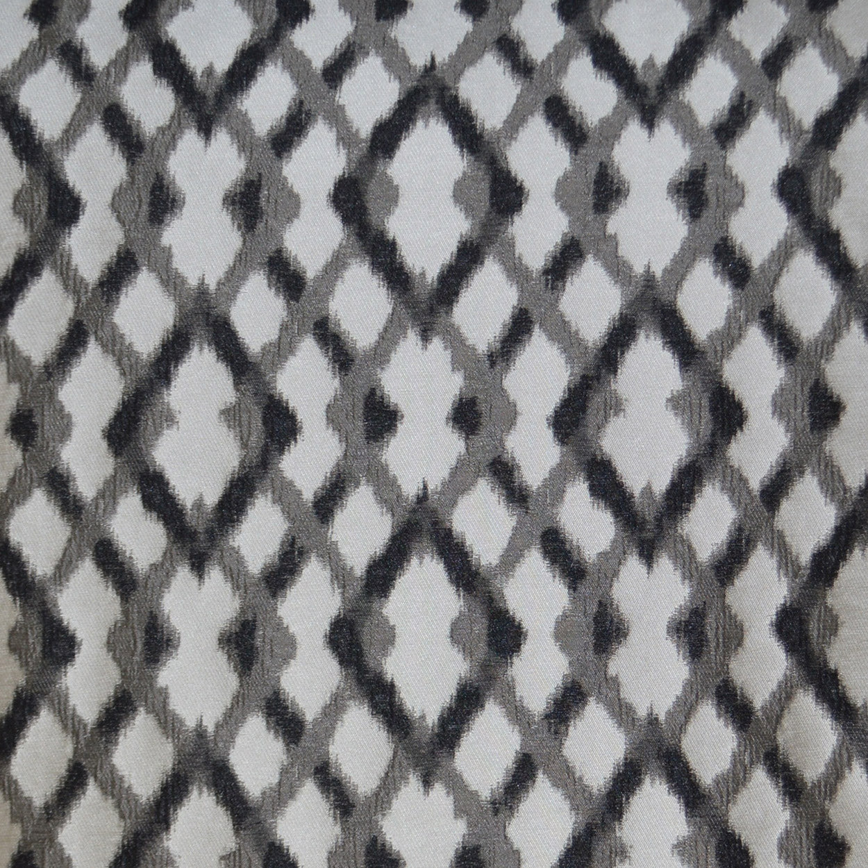 Grey & charcoal diamond lattice pillow with a snakeskin-inspired geometric pattern, 24" x 24".