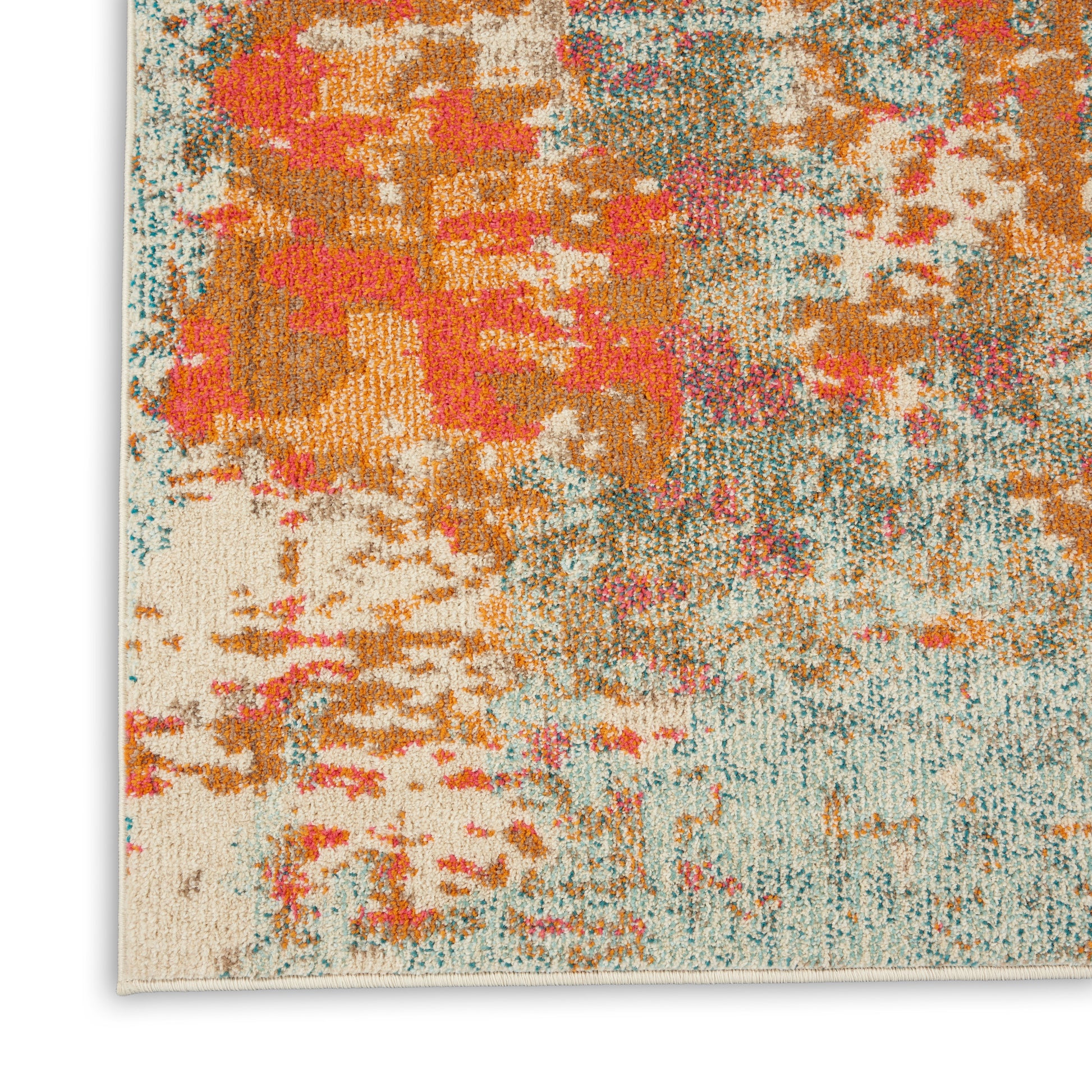 Abstract colorful rug close-up: cream base with orange, coral, teal and pink patches; plush textured pile and bound edge.