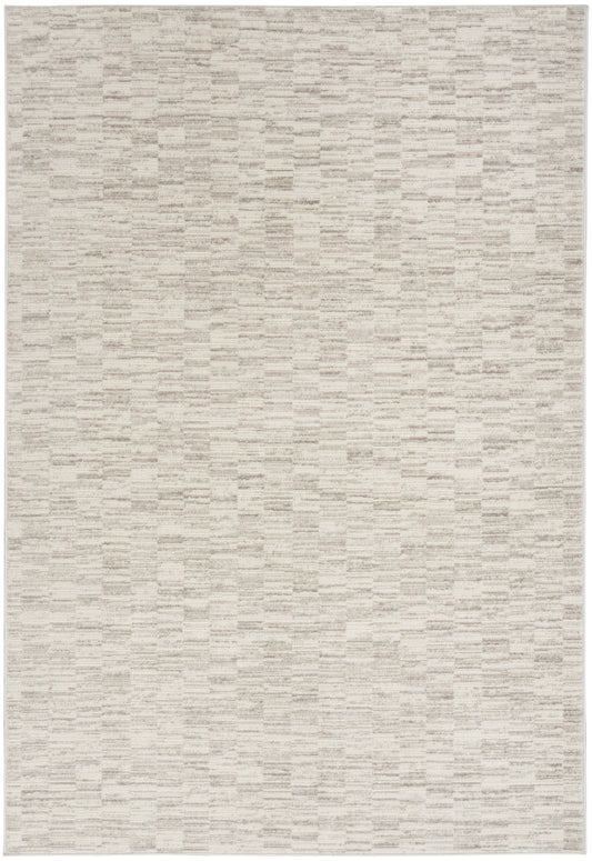 Neutral beige woven area rug with subtle rectangular pattern.