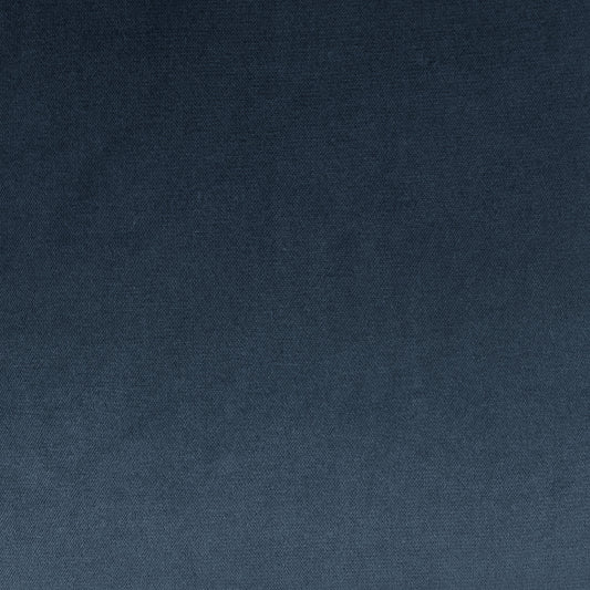 Blue fabric texture with a subtle gradient from dark navy to medium blue; woven textile for upholstery or crafts.