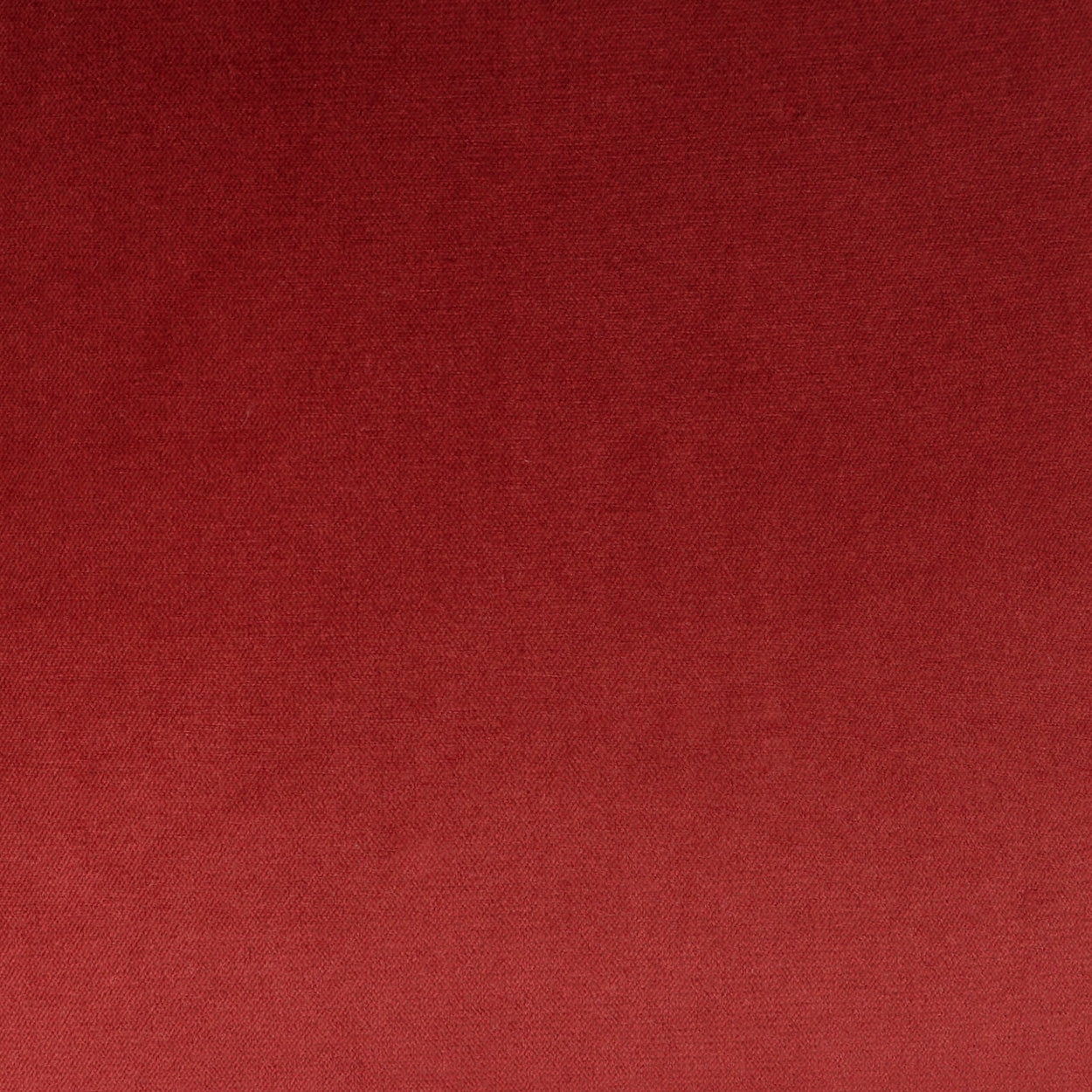 Deep red fabric texture with a soft woven surface.