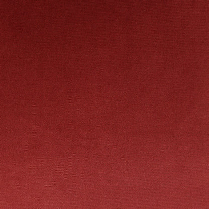 Close-up of deep red burgundy pillow fabric texture.