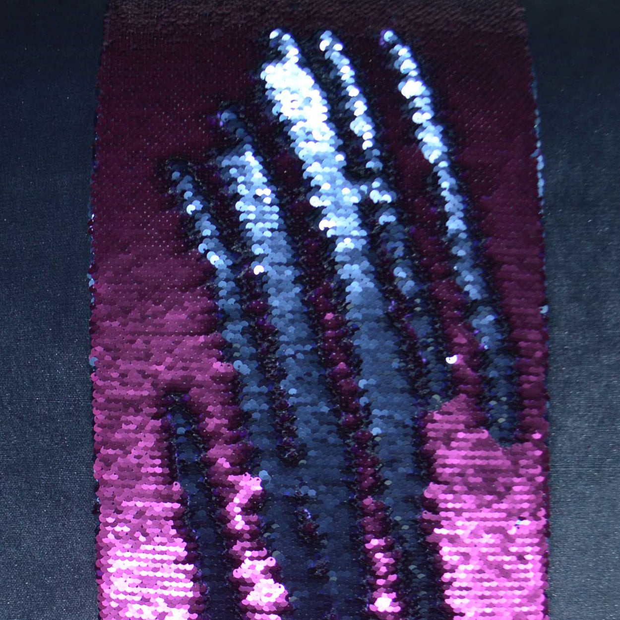 Purple gradient sequin fabric swatch with vertical metallic blue-silver stripes; sparkly eveningwear textile.