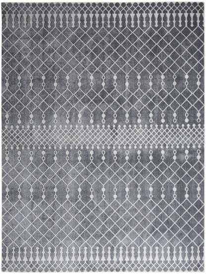 Gray area rug with white geometric lattice pattern and dot accents; modern decorative floor covering.
