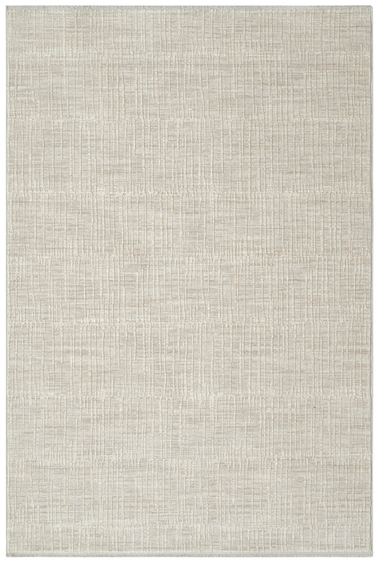 Beige rectangular rug with a subtle raised geometric grid pattern and soft textured pile.