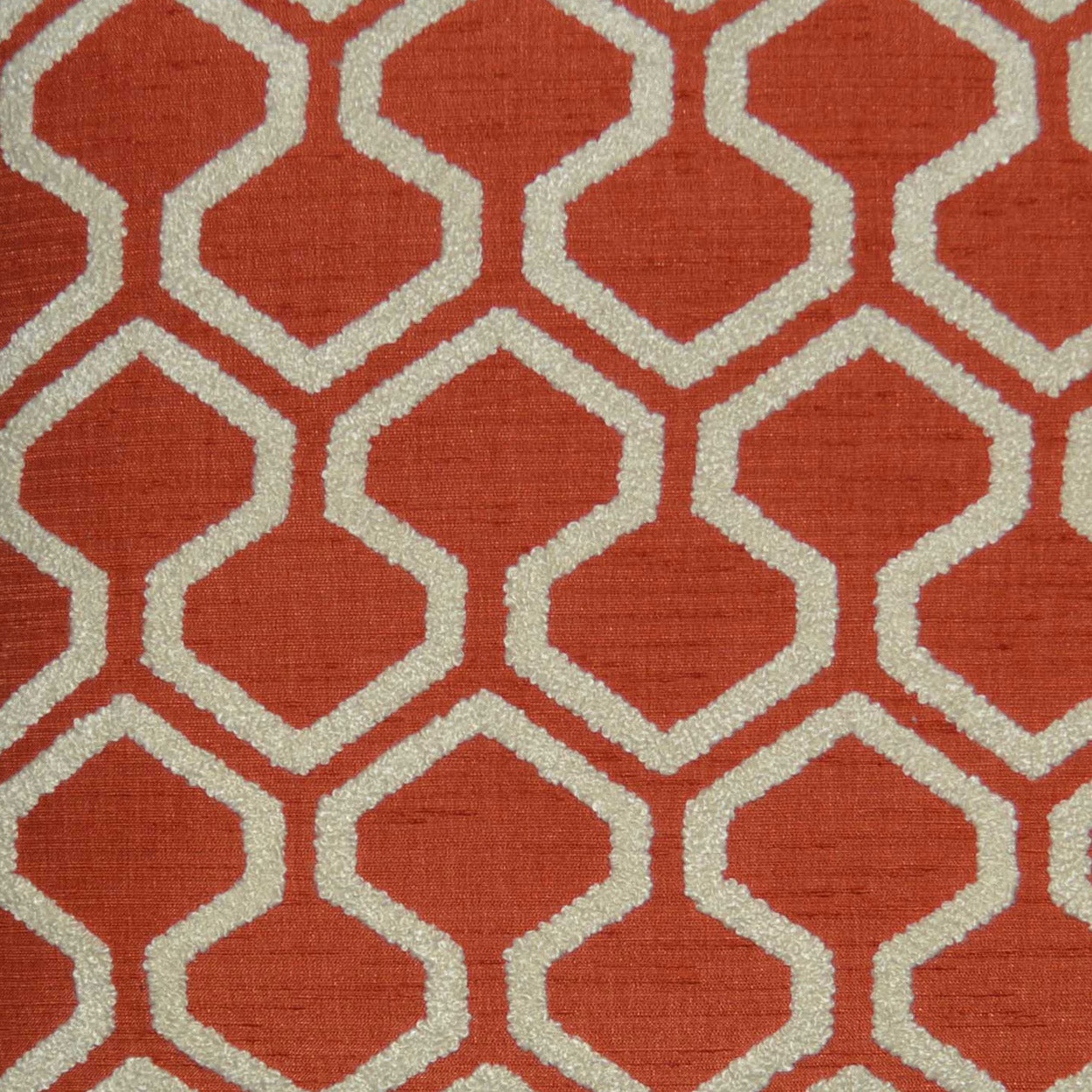 Red-orange pillow with cream interlocking geometric lattice (Moroccan trellis), textured fabric with raw edges, 24" x 24".