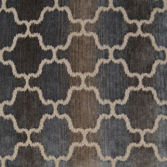 Navy and beige rug with cream interlocking quatrefoil lattice pattern; woven textile.