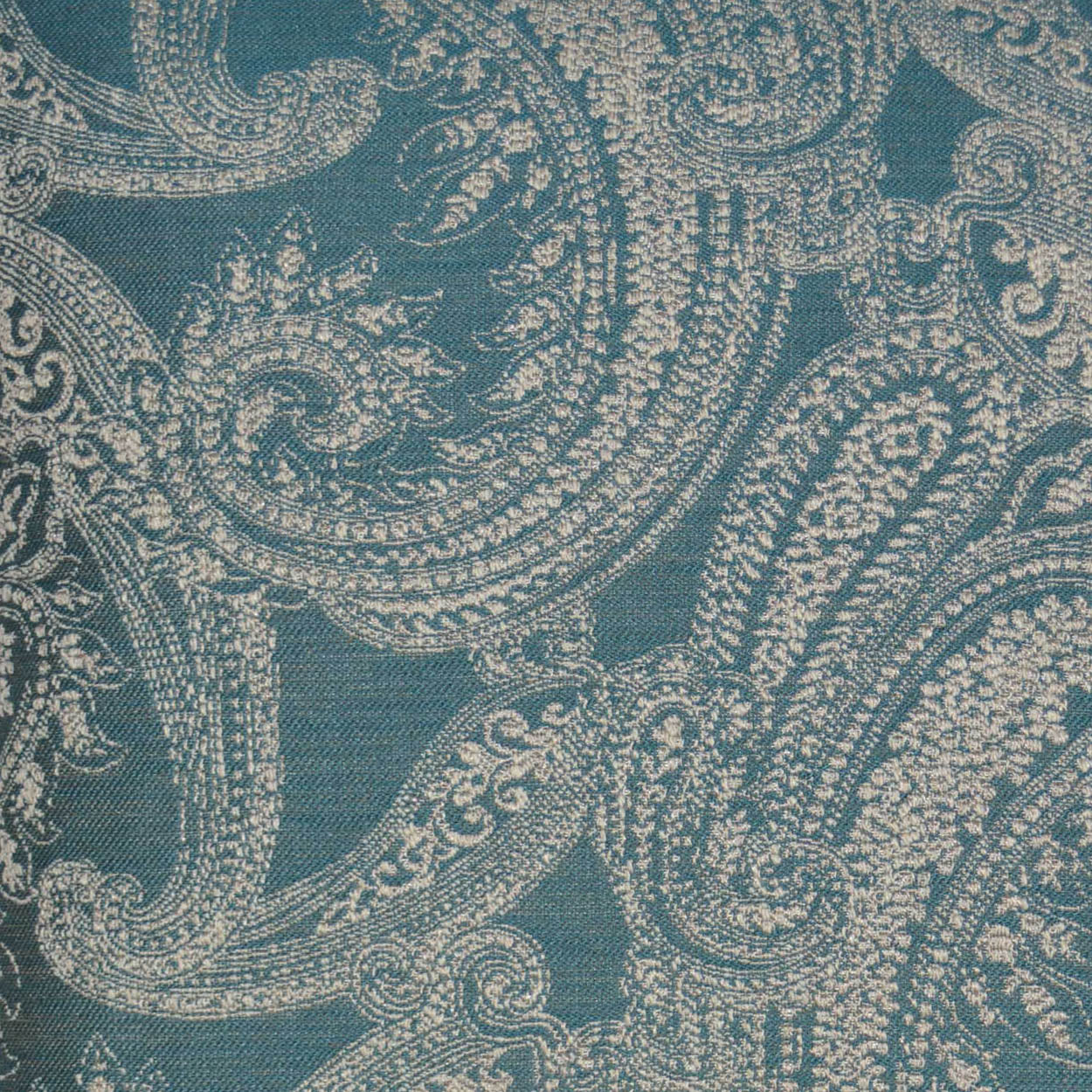 Teal fabric with cream damask scroll pattern; jacquard-woven textile suitable for upholstery.