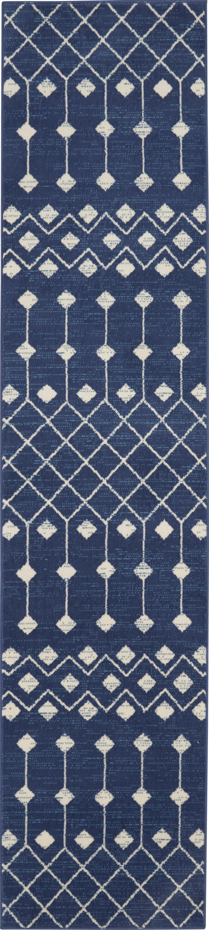 Navy blue runner rug with white geometric lattice, diamond motifs and zigzag borders for a modern look.