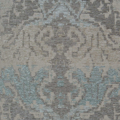 Damask-patterned pillow with ornate floral motifs in muted gray-beige and soft teal accents, 24" x 24
