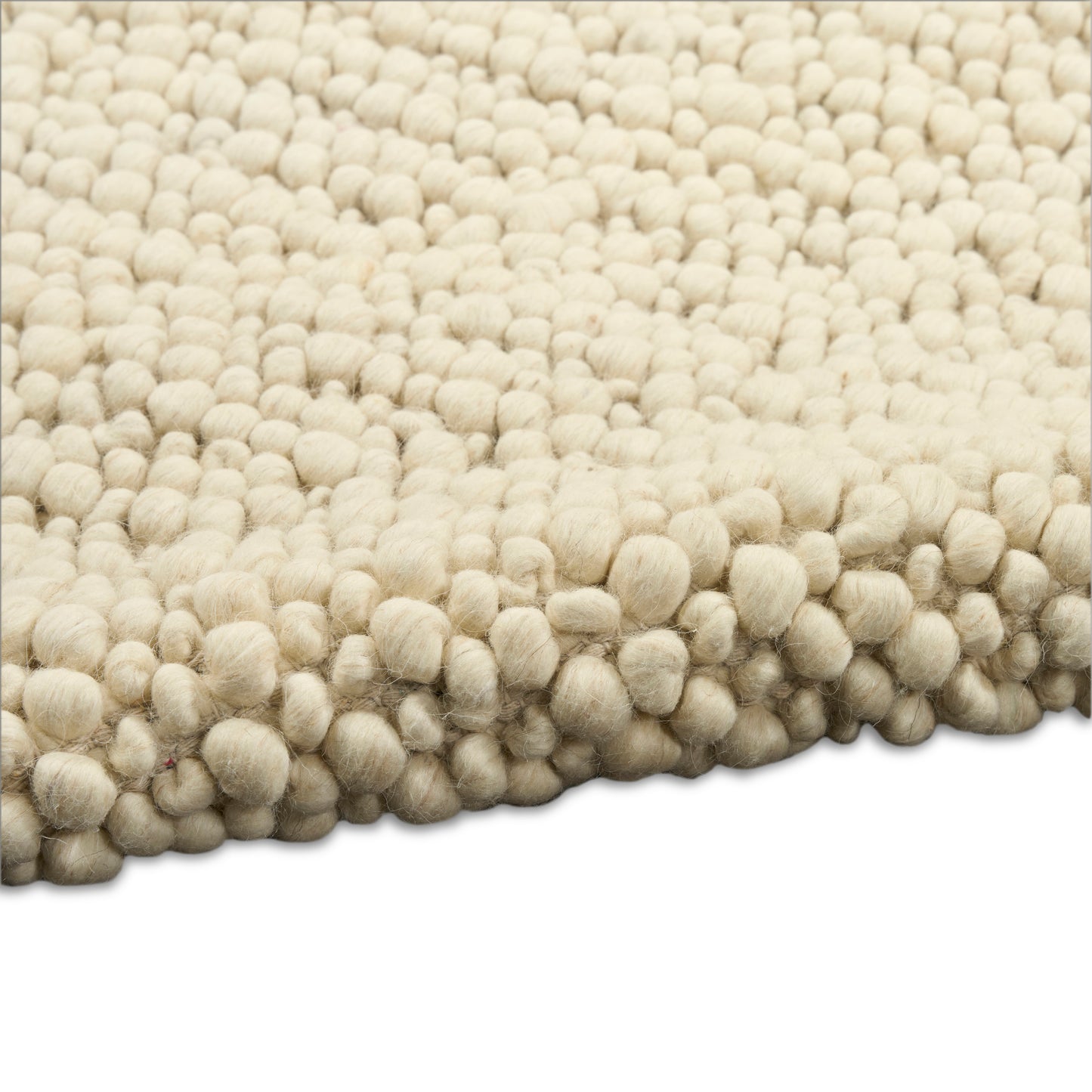 Cream boucle rug with dense ball tufts, plush shag texture for living room decor.