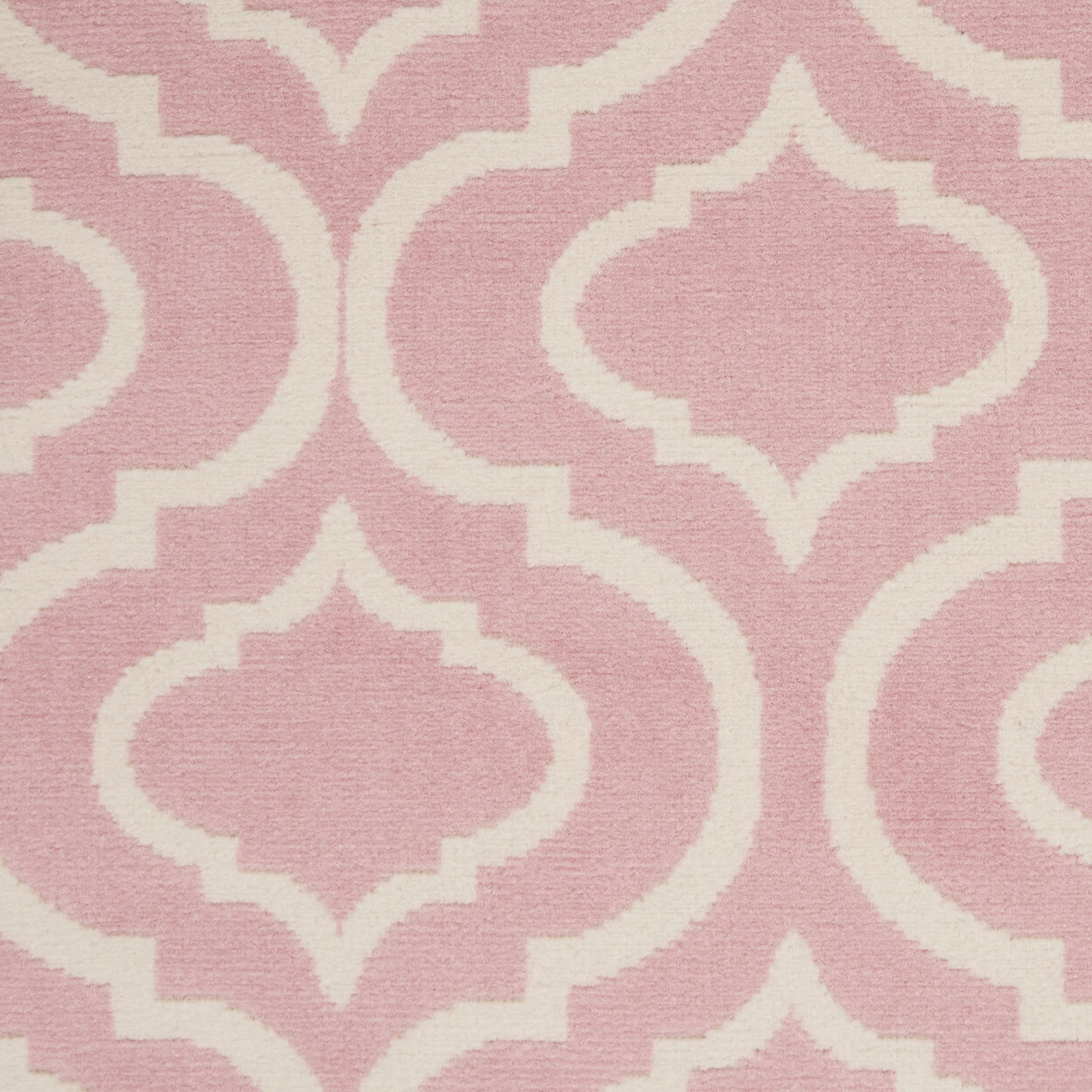 Soft pink rug with a white Moroccan trellis geometric lattice pattern, 6' x 9'.