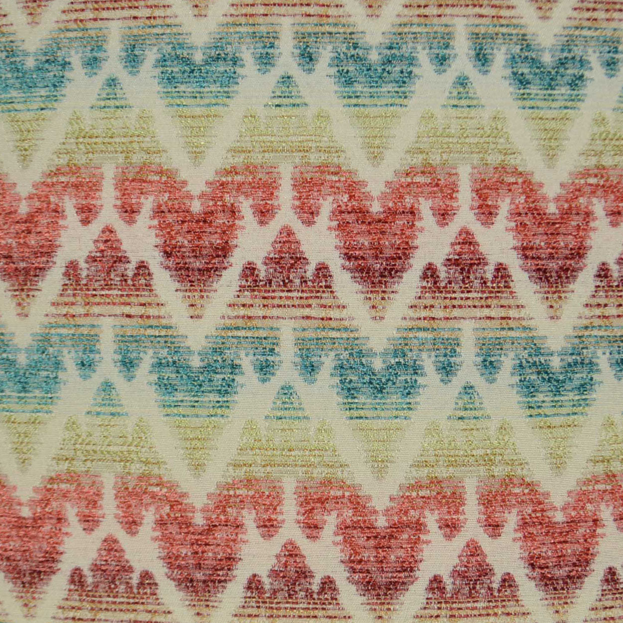Pastel chevron-patterned fabric with repeating triangles in red, teal, yellow on cream, textured woven surface.
