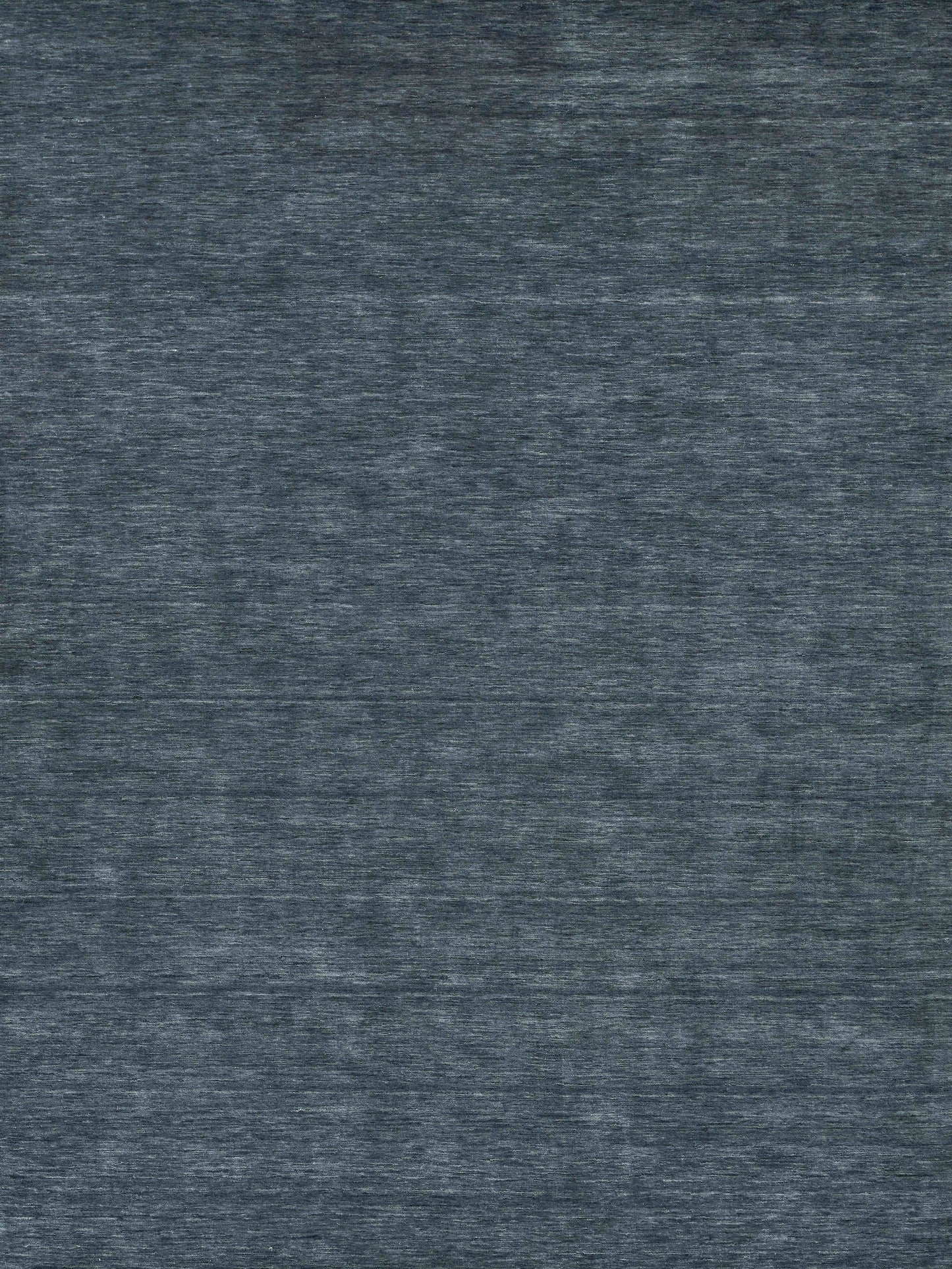 Blue-gray heather rug close-up with a soft, textured surface.