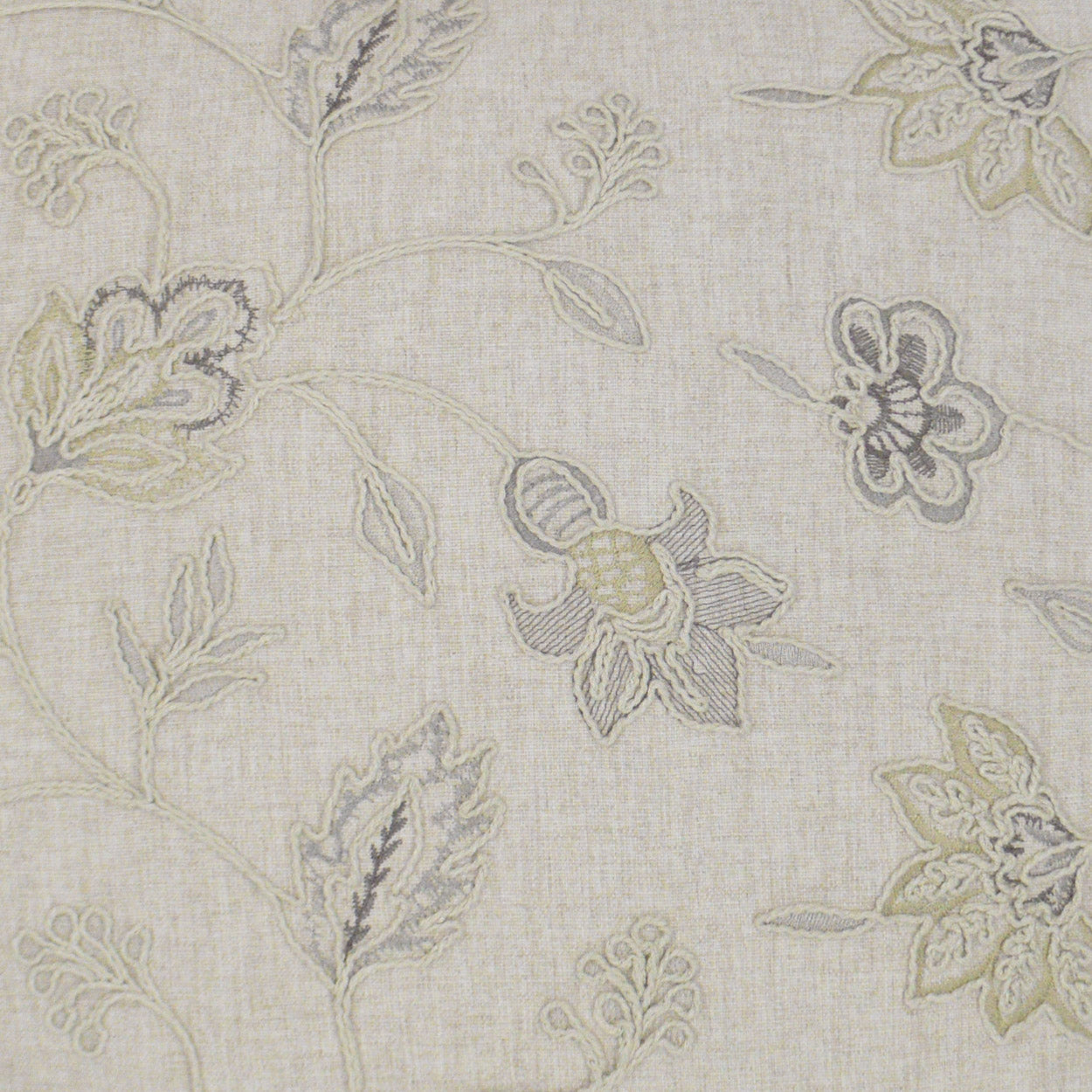 Beige linen-like fabric with a subtle pastel floral print in pale yellows, blues and grays.