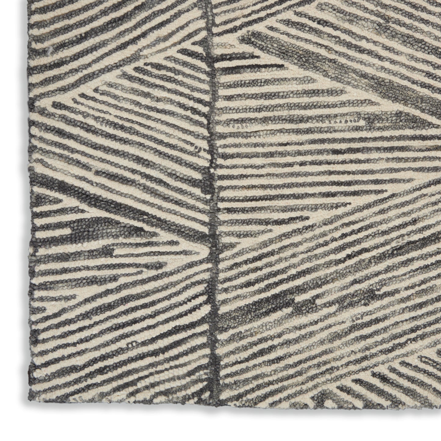 Textured cream rug with dark gray linear leaf pattern; boucle loop pile for a modern geometric look.