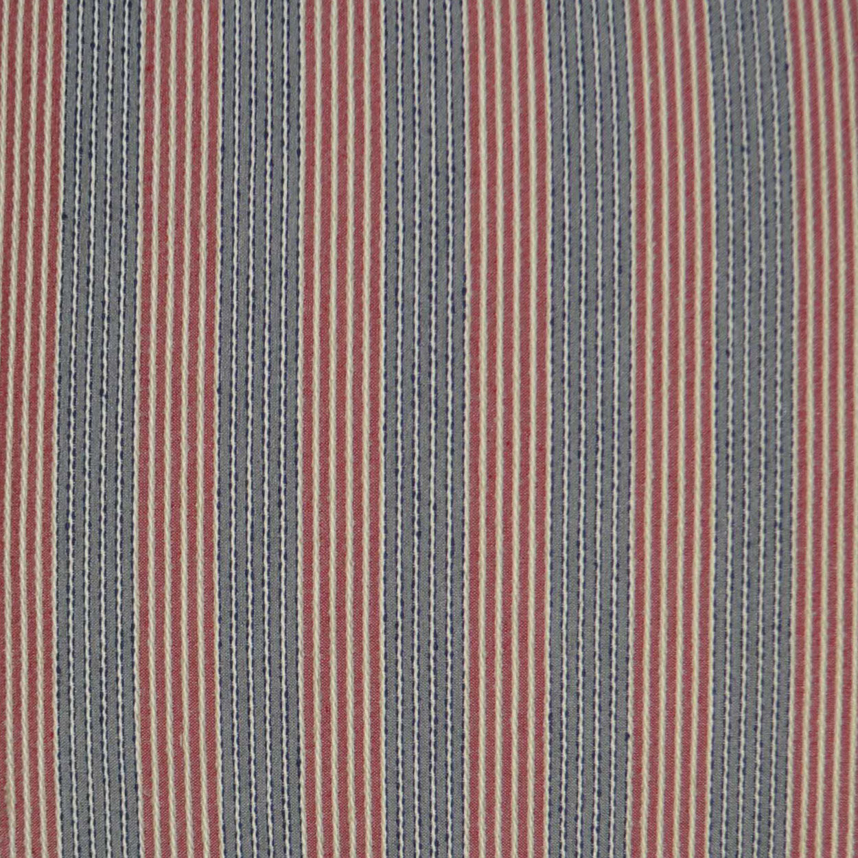 Vertical striped woven fabric in red, navy blue & beige; versatile textile for upholstery or apparel.