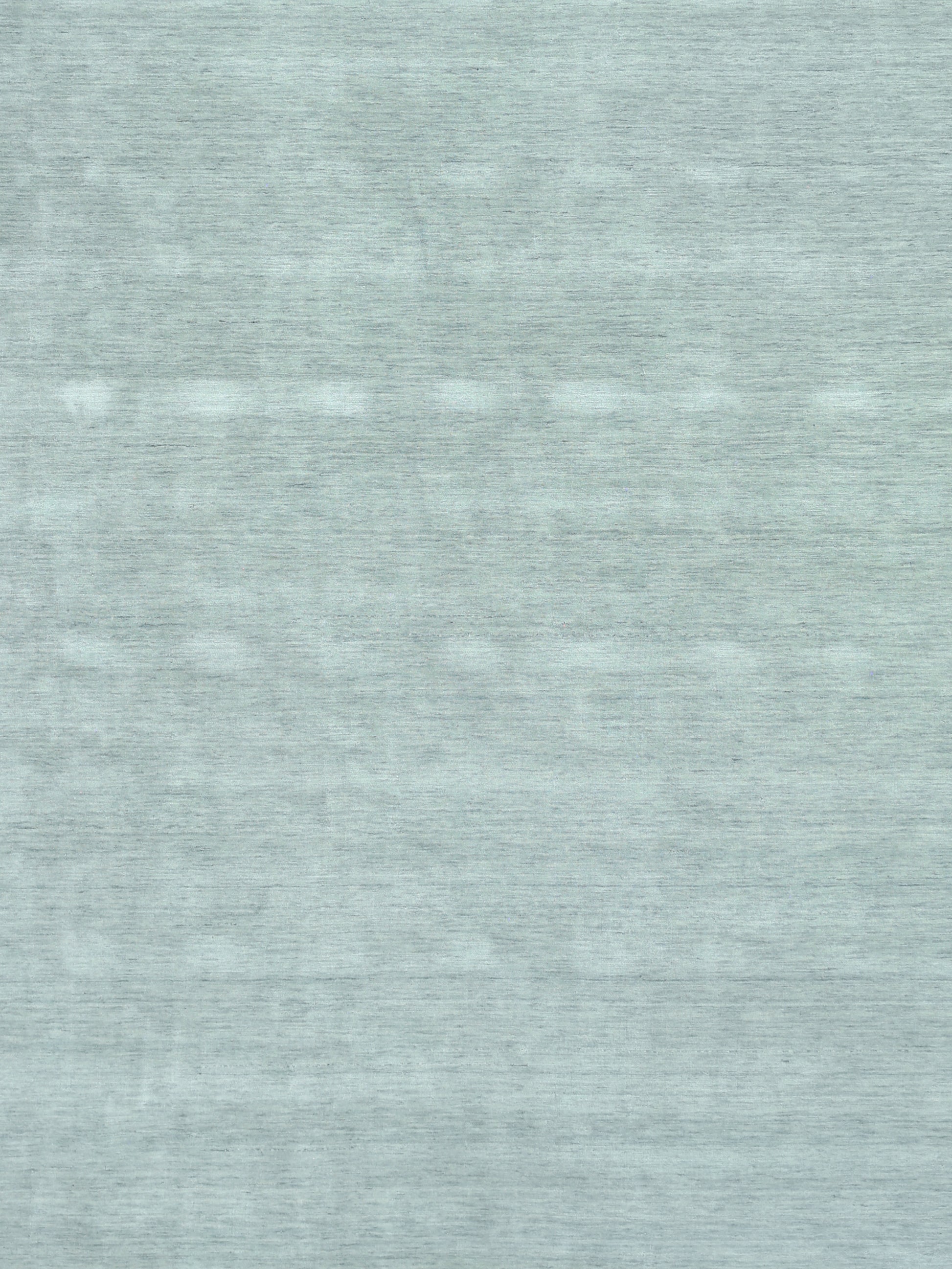 Light blue heathered hand loomed rug with subtle horizontal grain.
