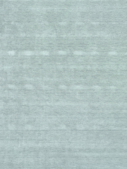 Close-up of a light blue heathered rug texture; soft, versatile rug for home decor.